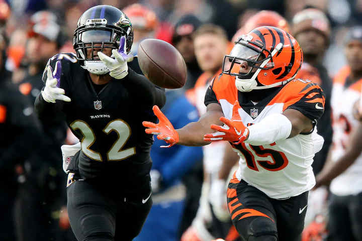 Cincinnati Bengals wide receiver John Ross (15) is unable to catch a deep pass down the sideline as Baltimore Ravens cornerback Jimmy Smith (22) defends in the fourth quarter at M&T Bank Stadium in Baltimore.   (Kareem Elgazzar / The Cincinnati Enquirer)